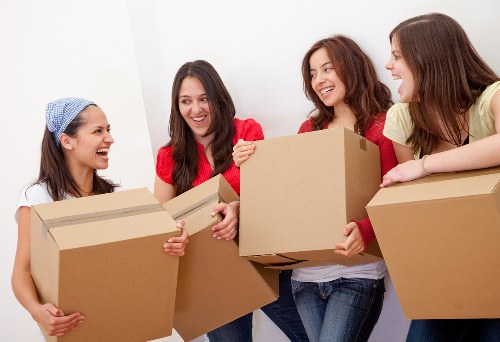 Local packing team handling office items for a Stockwell business relocation