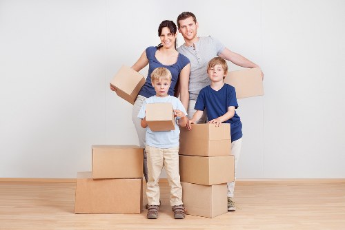 A small removals team loading items for a South London move
