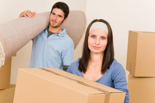 Professional movers handling desks and IT equipment